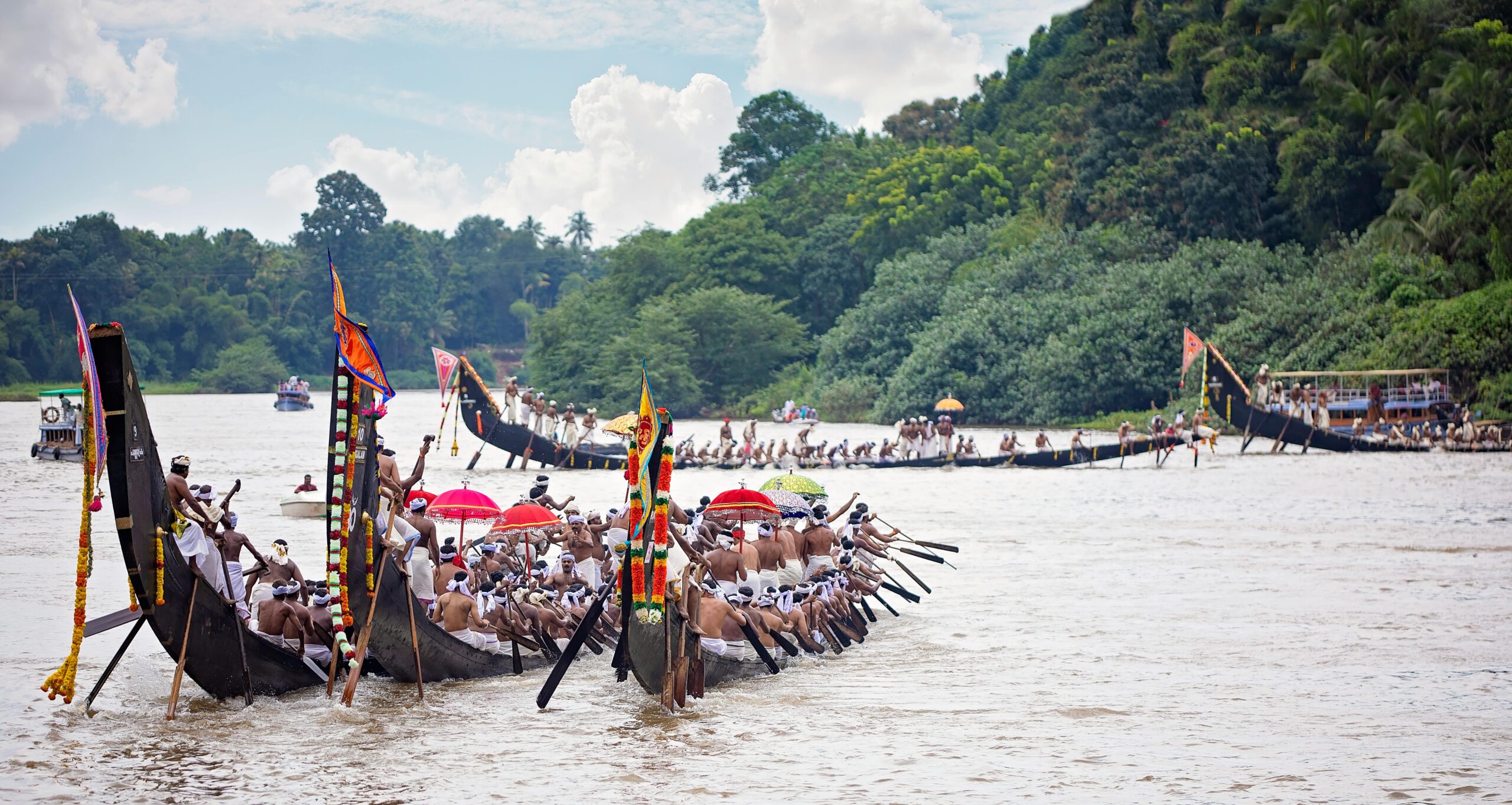 Exciting snake boat race on Pampa River in Kerala, showcasing vibrant cultural tradition.